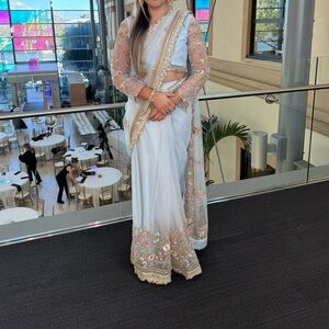 Elegant White and Gold Embellished Saree